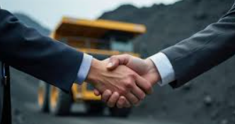 Business handshake at a coal mining site